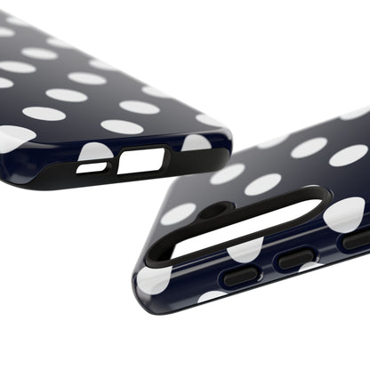 Navy blue phone case with white polka dots and wireless charging support
