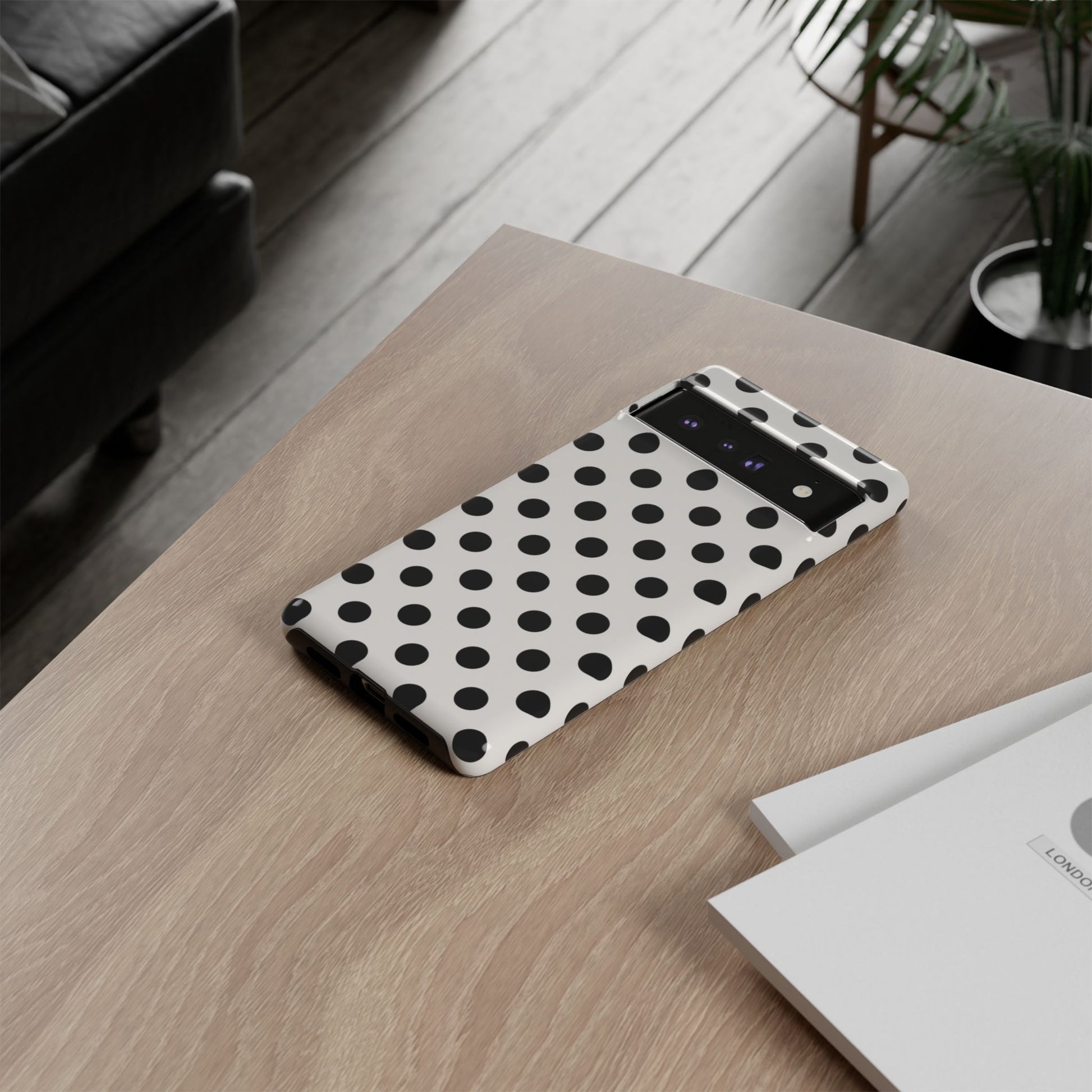 Black polka dot phone case port cutouts for charging, speakers, and buttons with precise fit
