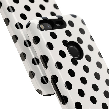 Close-up of black polka dot phone case showing UV-resistant print quality and precise dot pattern detail
