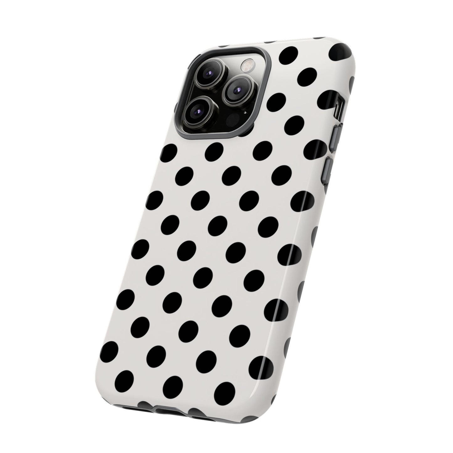 Black polka dot tough phone case on white background showing slim profile and wireless charging compatibility
