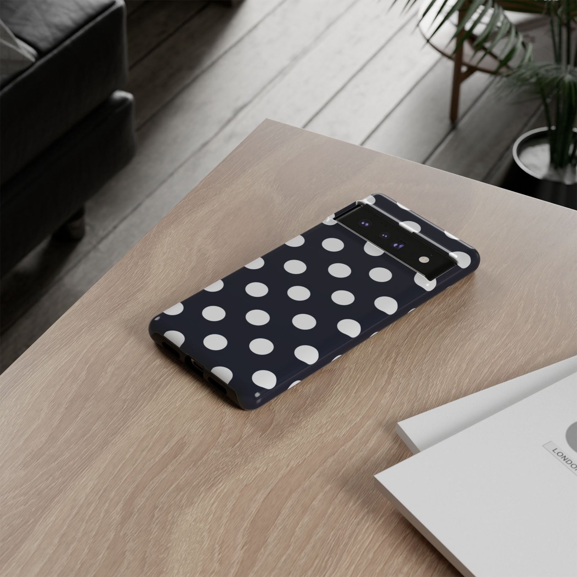 Nautical preppy phone case featuring navy and white polka dot design
