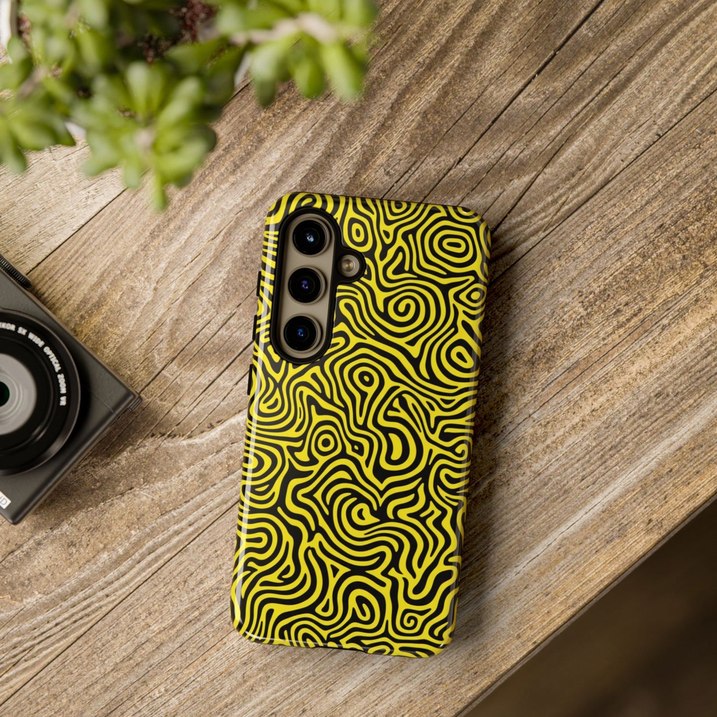 Modern psychedelic phone case featuring bold yellow black abstract waves with 3D wrap print

