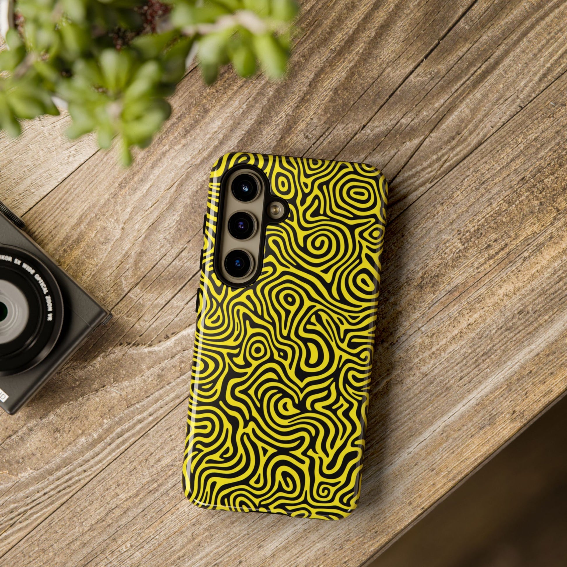 Modern psychedelic phone case featuring bold yellow black abstract waves with 3D wrap print
