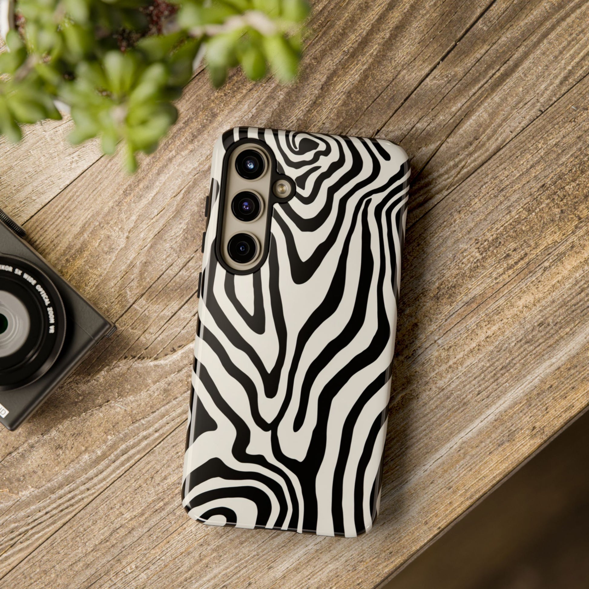 Fashion phone case with zebra swirl design - organic flowing pattern for style-conscious users
