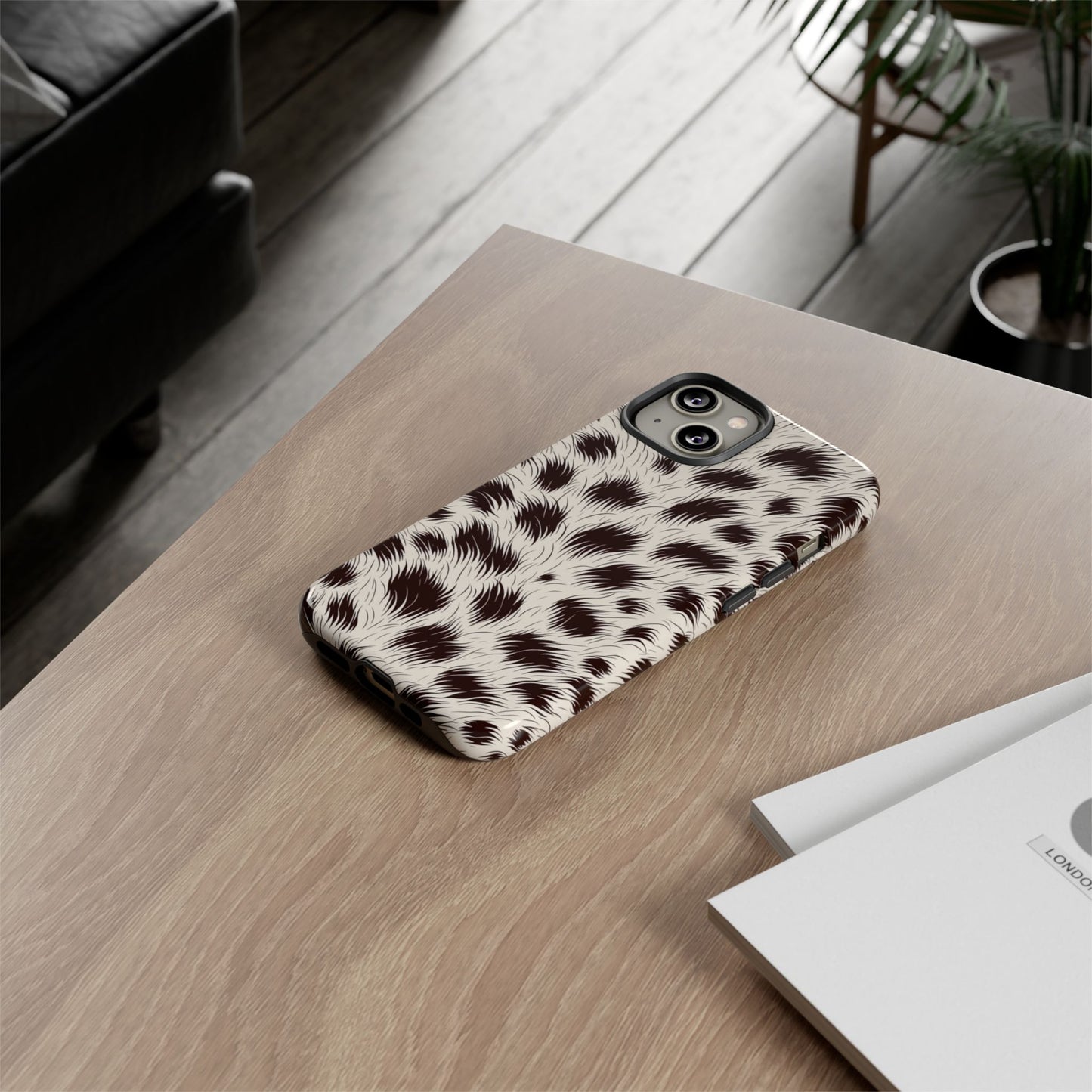 Leopard print phone case featuring polycarbonate shell and TPU liner
